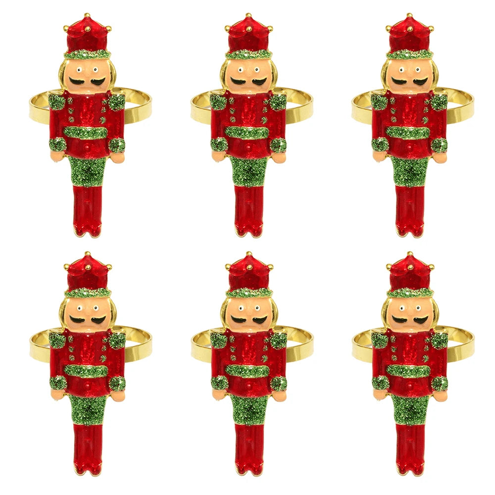 Red Crown Nutcracker Napkin Rings — Set of 6. A nutcracker with a red crown, red trousers, and green jacket details.