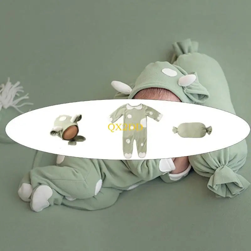 Baby wearing green cow romper costume set with hat and pillow