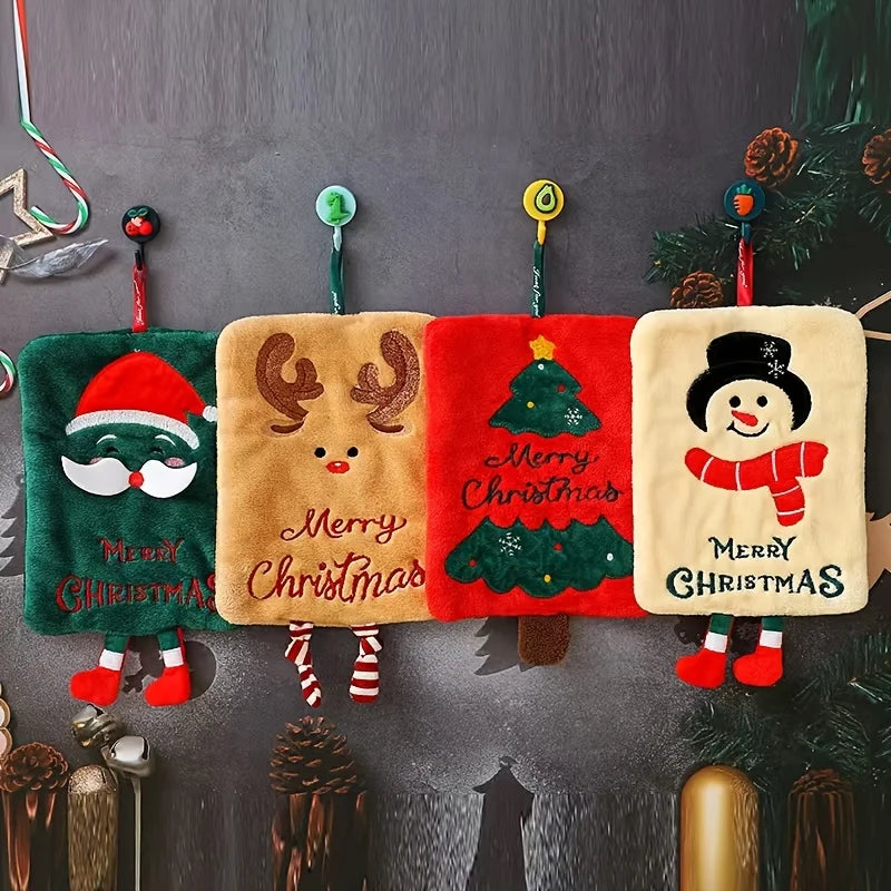 Four hanging Christmas hand towels with Santa, reindeer, tree, and snowman designs