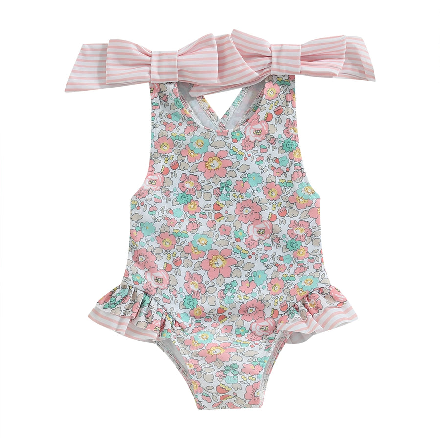Floral Bow Backless Swimsuit displayed on hanger