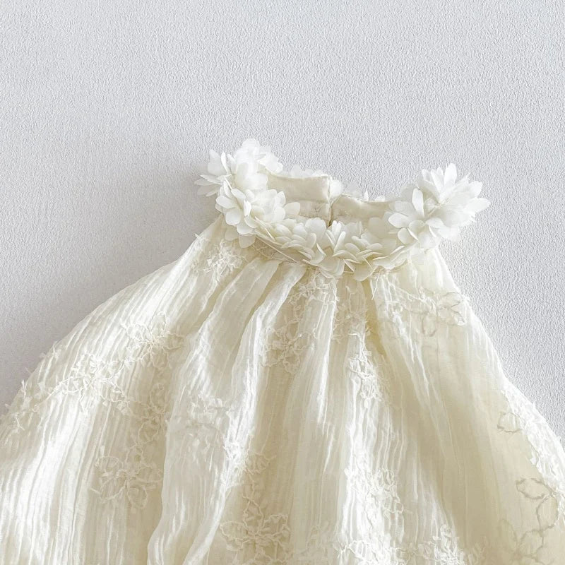 Close-up of lace ruffle collar on baby romper