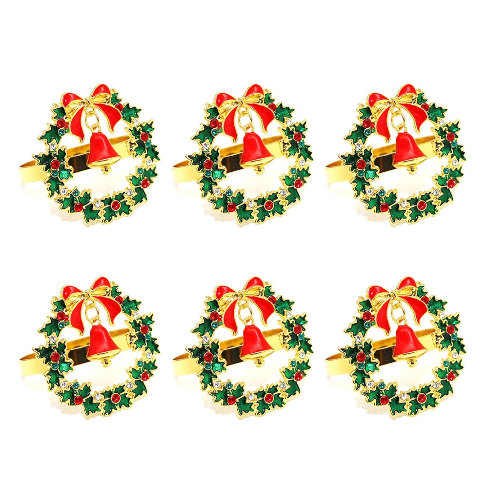 Christmas Wreath and Bell Napkin Rings — Set of 6. A green wreath with a red bell and bow.