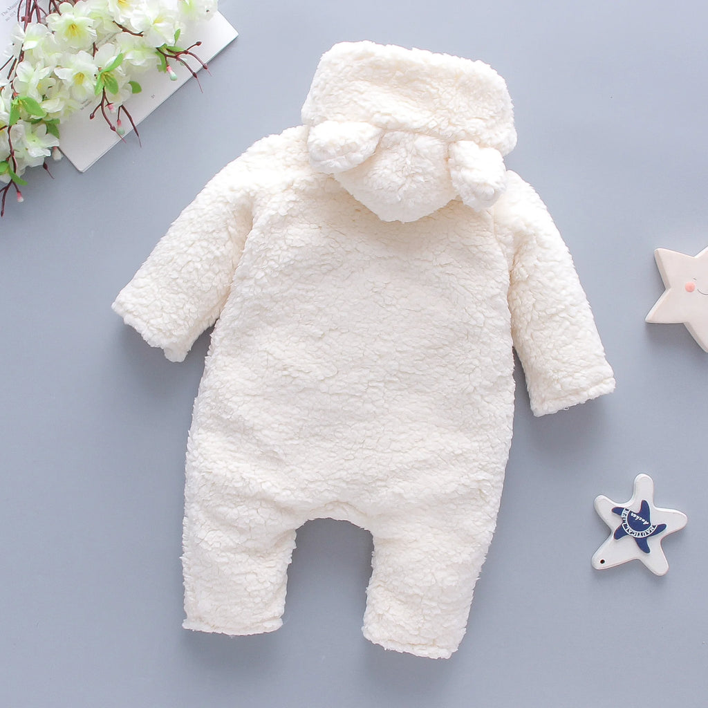 Close-up of embroidered bear detail on lamb hair baby romper