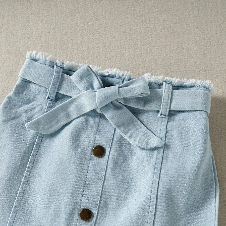 Blue skirt with gathered waist, tie, and front button detail