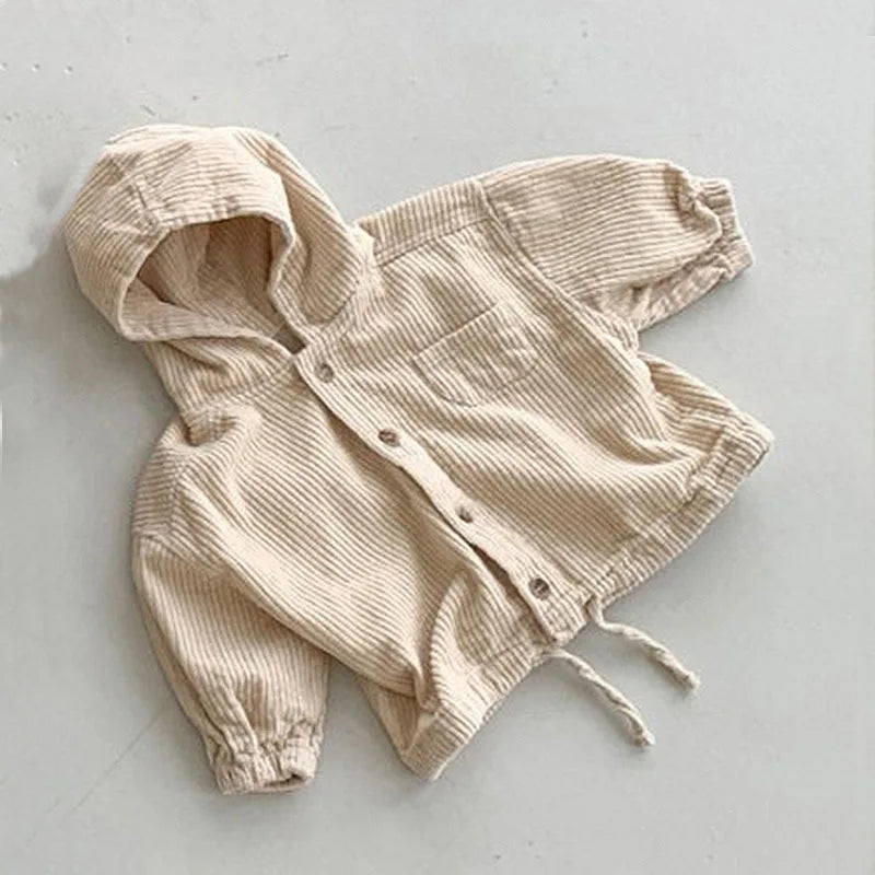 Detail of hood and sleeves on autumn denim and corduroy hooded jacket