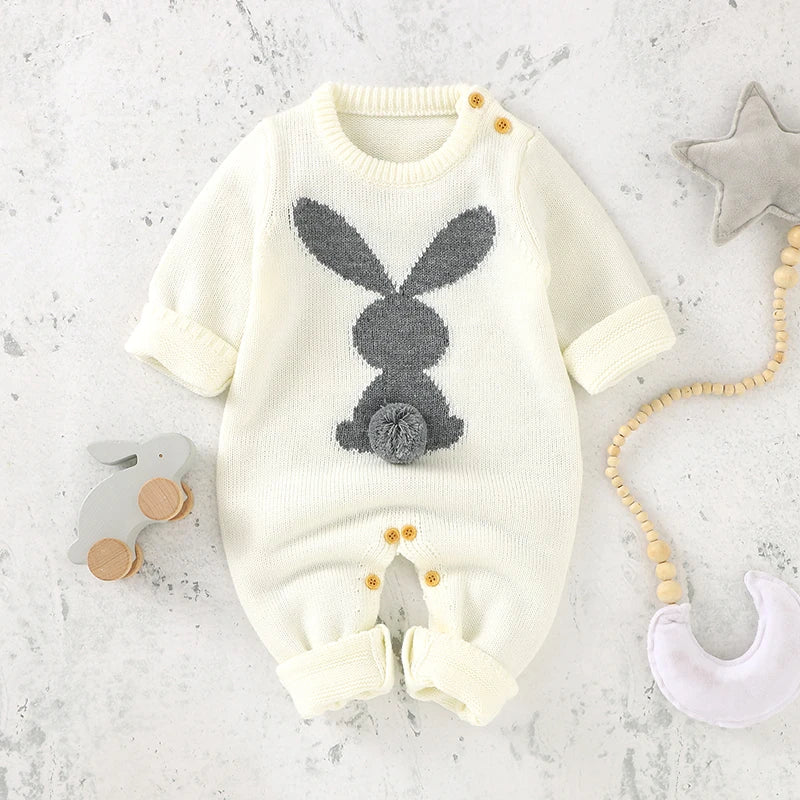 Knitted rabbit baby romper displayed flat