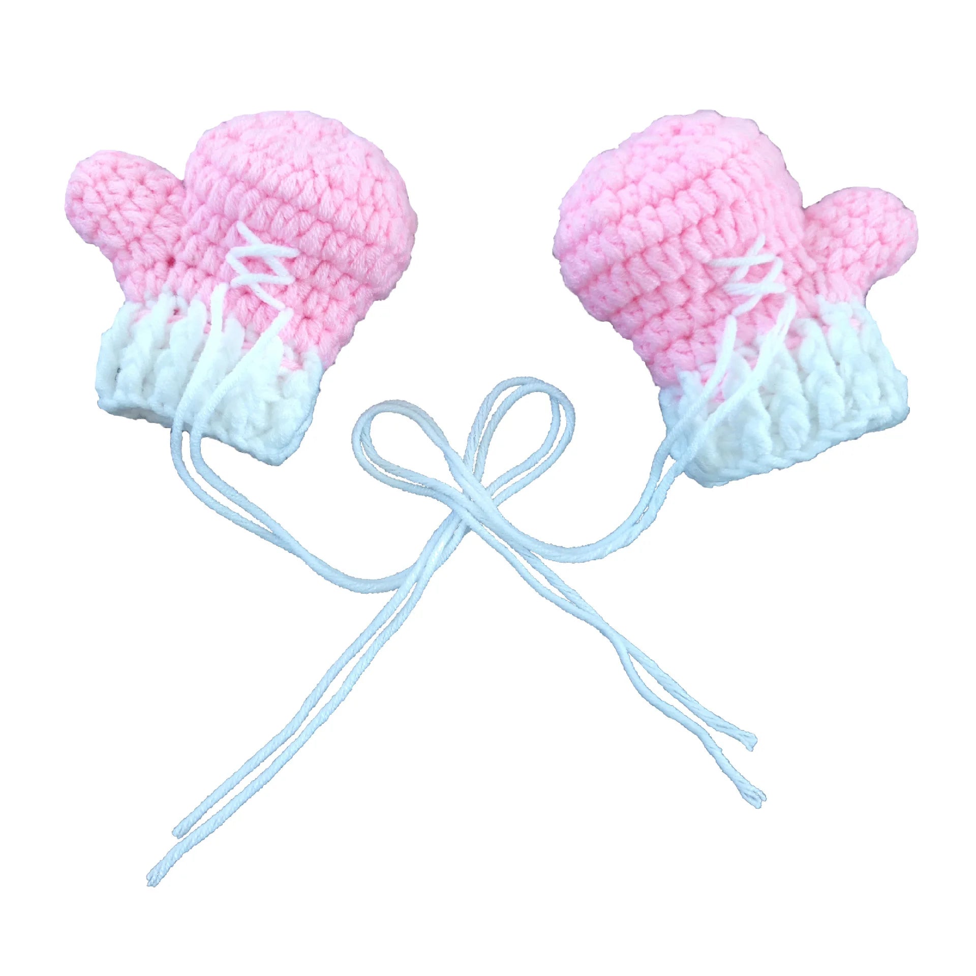 Pink crochet baby boxing gloves close-up