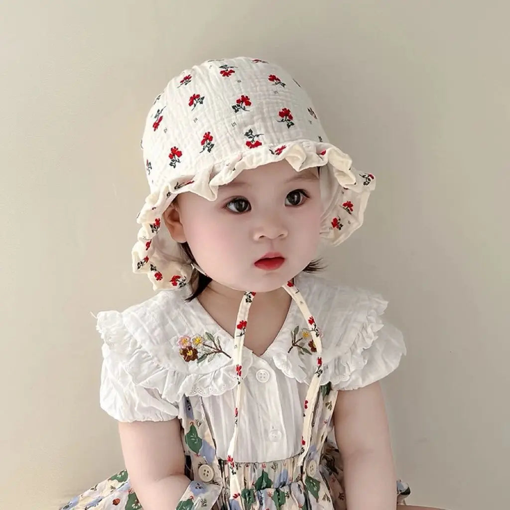 Floral Ear Protection Baby Hat on white background