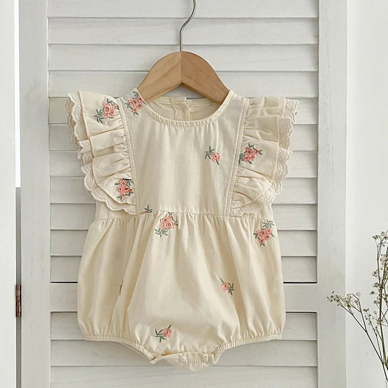 Baby girl sleeveless cotton bodysuit with floral embroidery front view