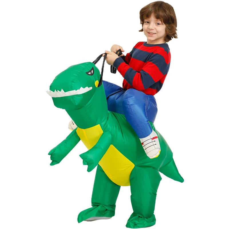 Child wearing green inflatable dinosaur costume with yellow belly and blue pants, holding dinosaur reins.
