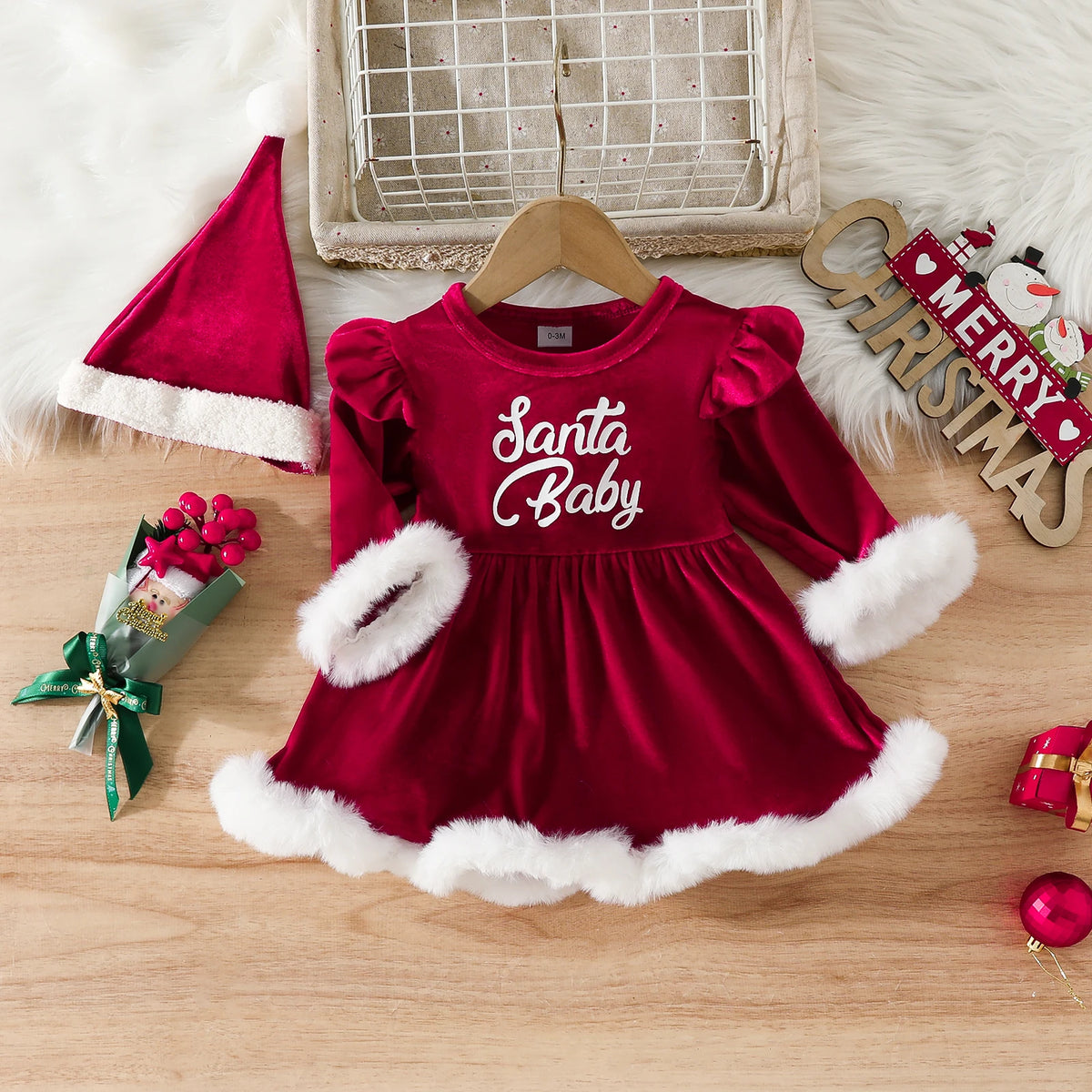 Red Santa Baby romper dress with puff shoulders, fluffy white cuffs and hem, shown with a coordinating Santa hat.