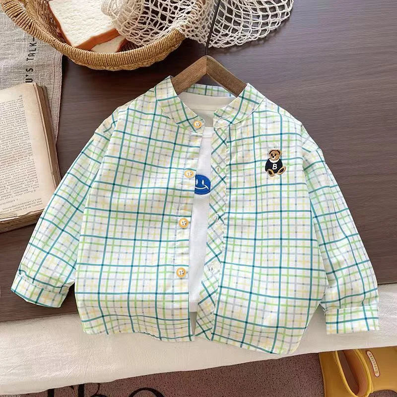 Blue and green plaid button-up shirt with embroidered bear patch