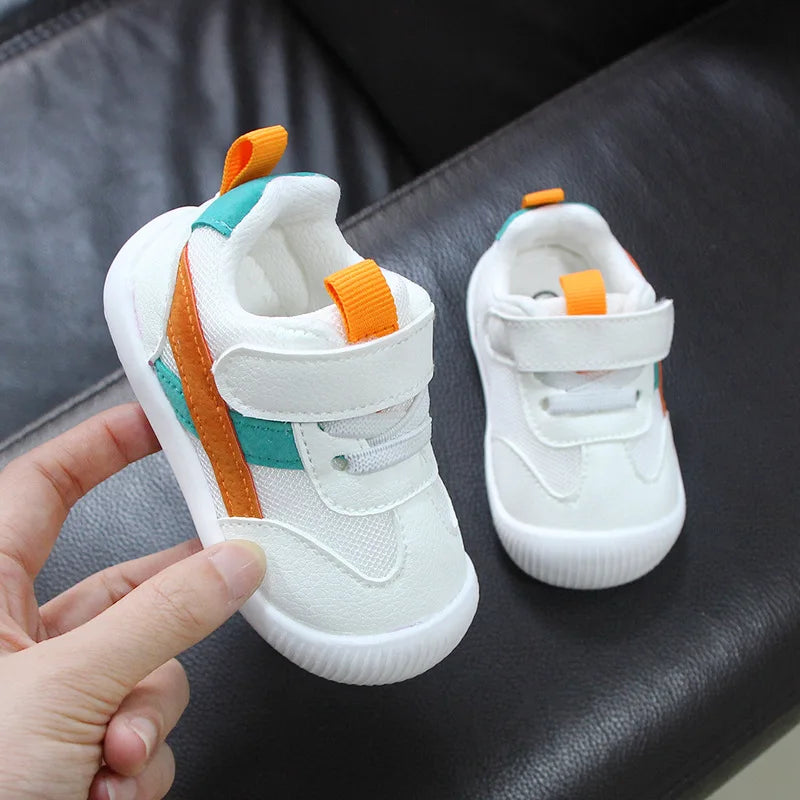 Pair of orange Airy Step breathable baby shoes