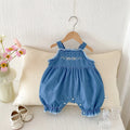 Child wearing cotton denim overall romper with bow embroidery