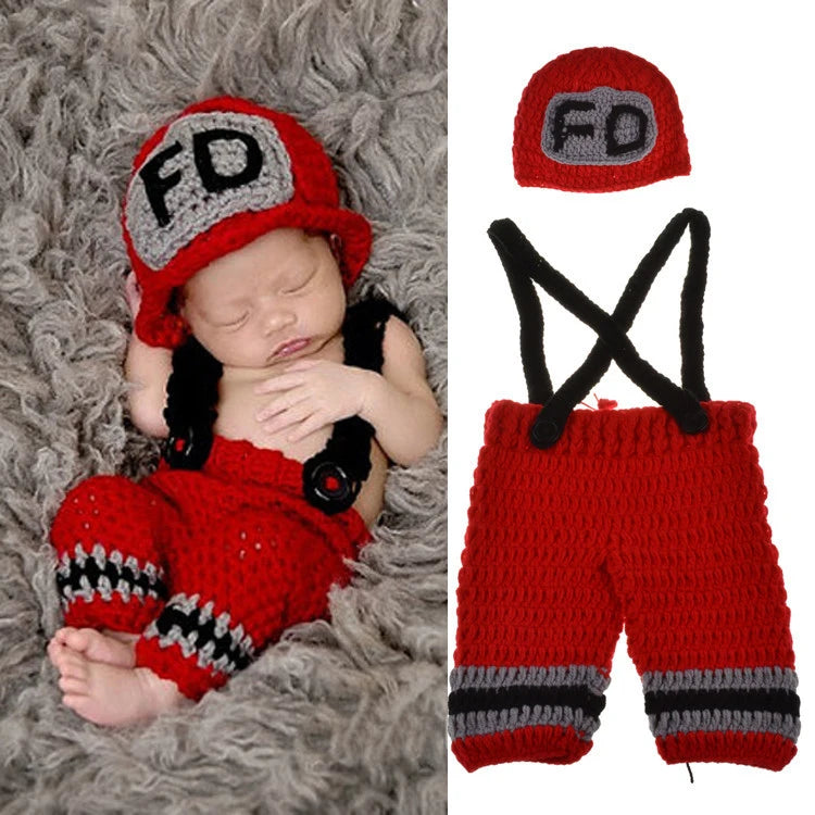 Newborn baby wearing red crochet firefighter costume set