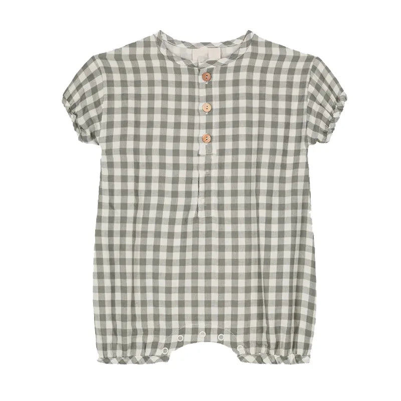 Baby romper laid flat showing breathable cotton material