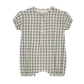 Baby romper laid flat showing breathable cotton material