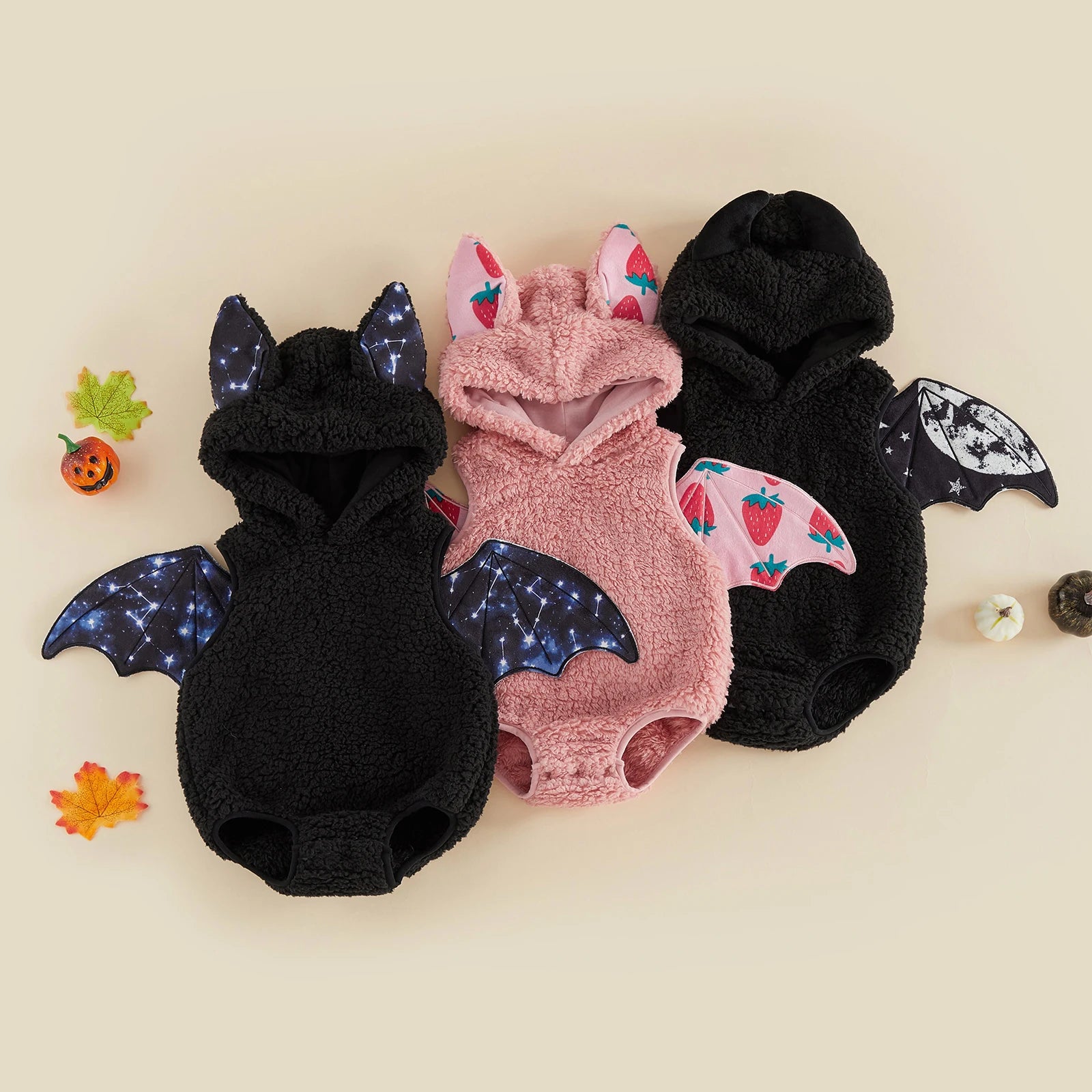 Group of infant bat wing romper costumes in different colors and wing patterns