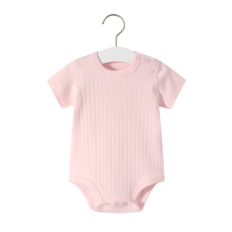 Baby wearing Petite Léonie Short Sleeve Bodysuit