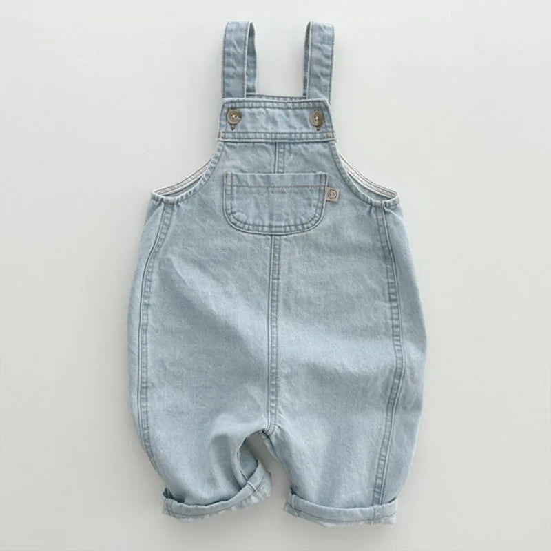 Toddler Wearing Cotton Pocket Overalls in Sky Blue Outdoors
