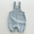 Toddler Wearing Cotton Pocket Overalls in Sky Blue Outdoors