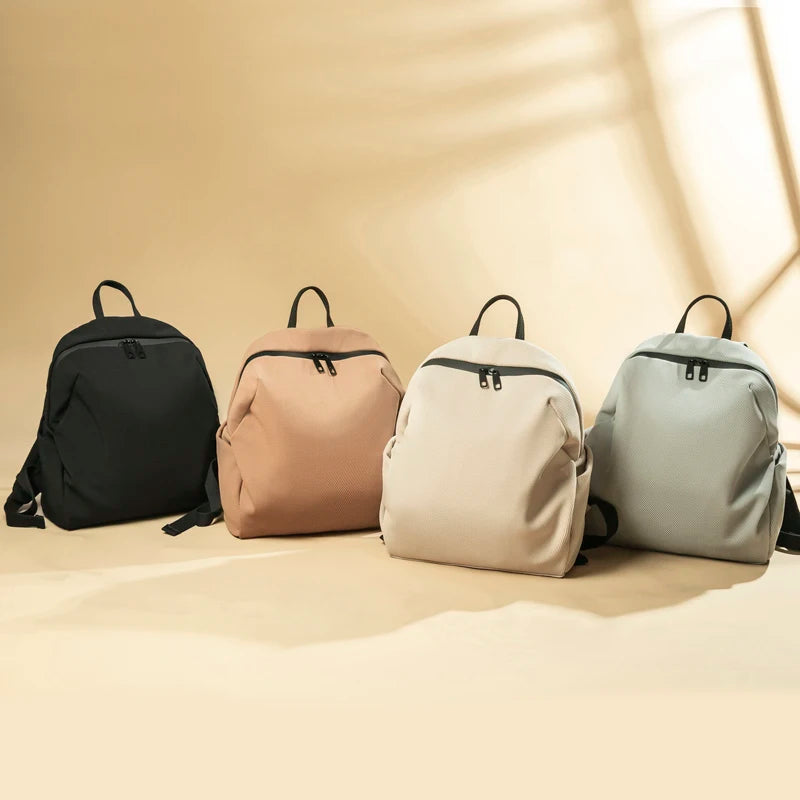 Lightweight Canvas Backpack in solid color with soft handle and arcuate shoulder straps