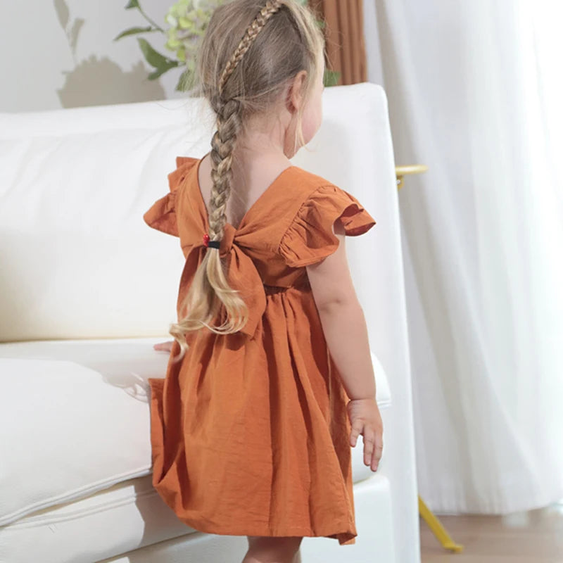 Rust ruffle-back occasion dress on a child