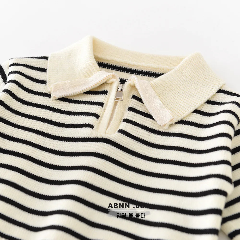 Close-up of zipper and collar on baby knitwear sweater cardigan