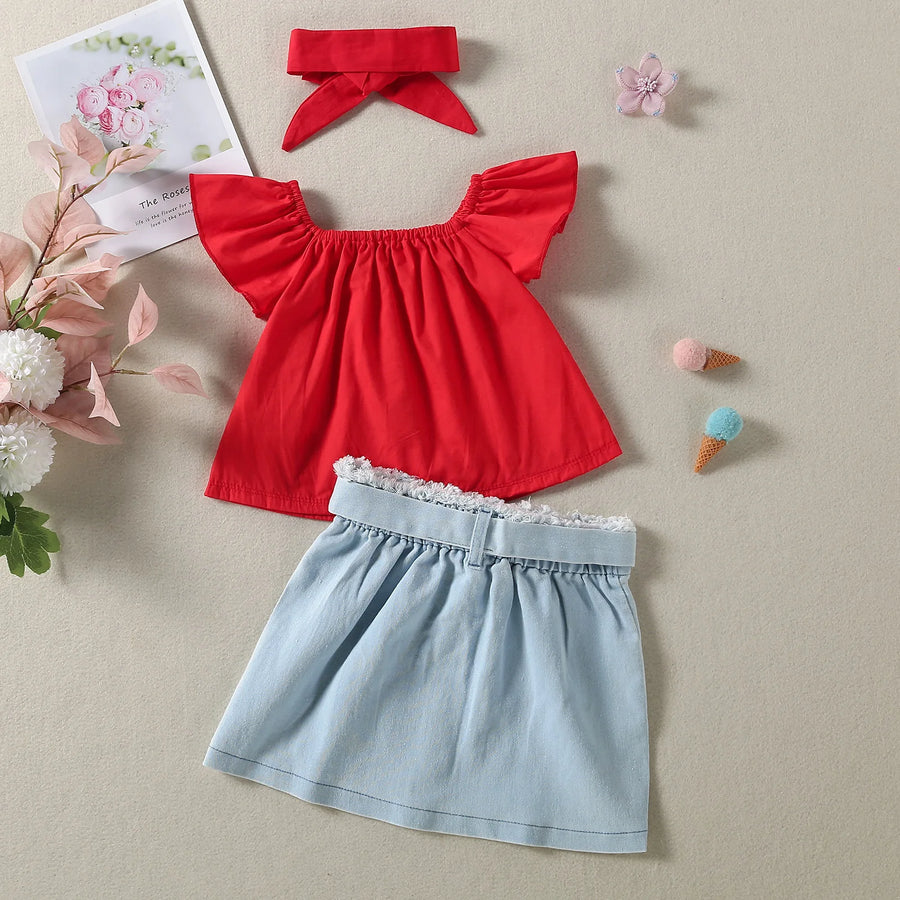 Crimson flutter top, blue button-detail skirt, and matching bow headband set