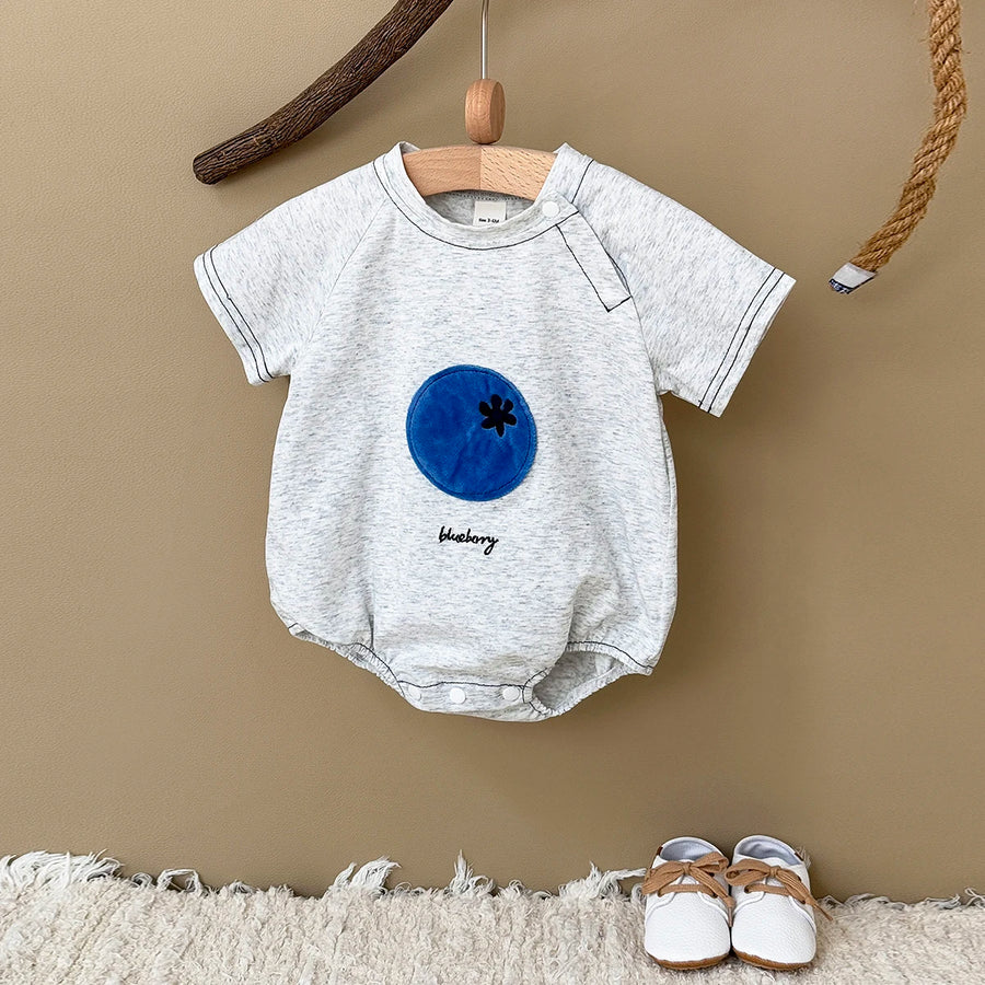 Gray Fruit Patch Bubble Romper displayed on hanger