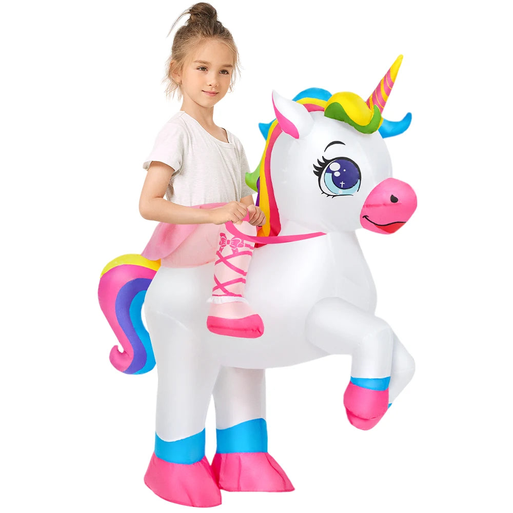 Child wearing an inflatable unicorn costume with colorful mane and pink hooves, appearing to ride the unicorn.