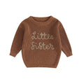 Toddler girl wearing cozy knit pullover sweater in pink color