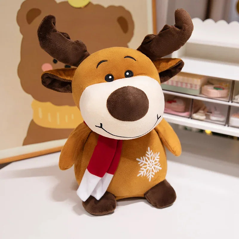 Reindeer Christmas plush figure with brown antlers, a red scarf, and a snowflake detail