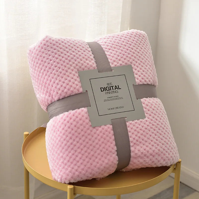 Baby blanket draped over stroller