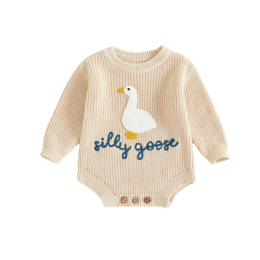 Knitted baby romper laid flat showing full design and embroidery