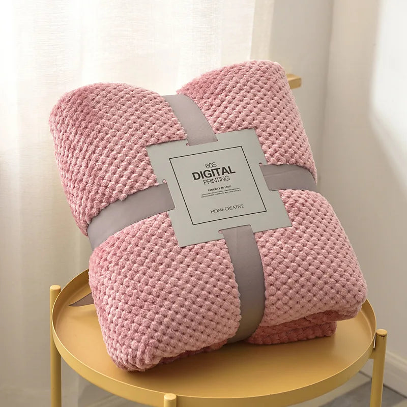 Pink soft fleece baby blanket folded neatly