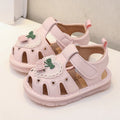 Pink squeaky baby sandals with hook-and-loop straps