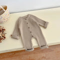 Knitted baby bodysuit displayed flat