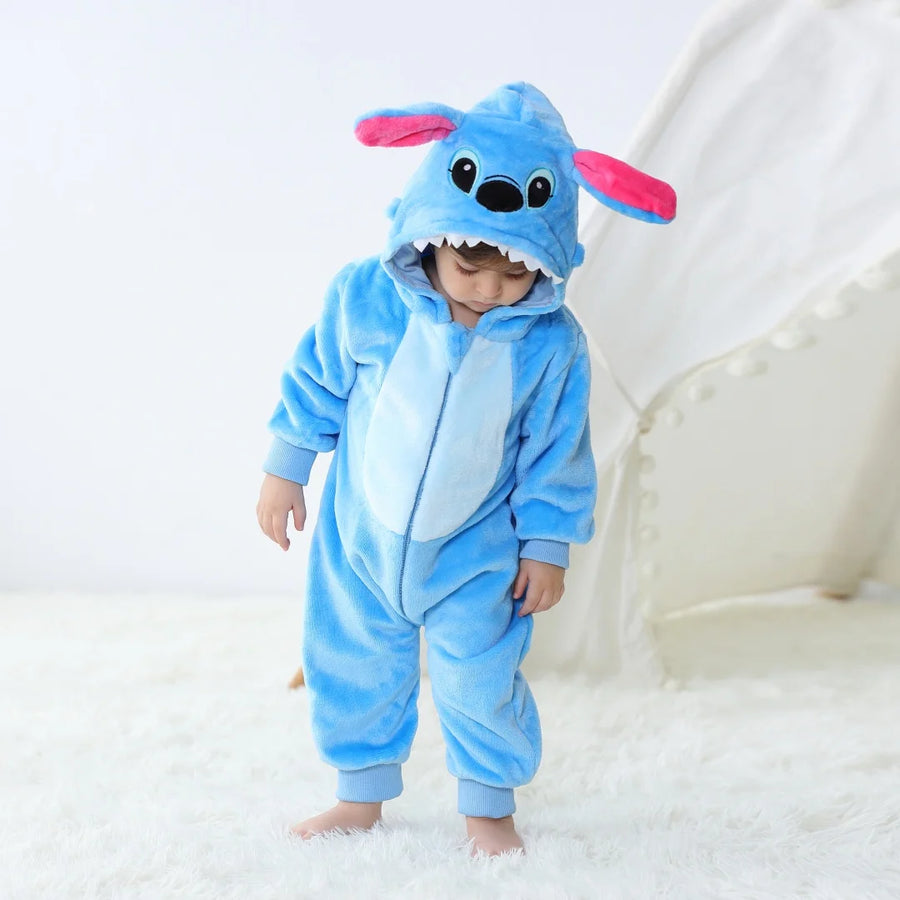 Toddler wearing blue animal hooded romper costume with ears and face details on hood