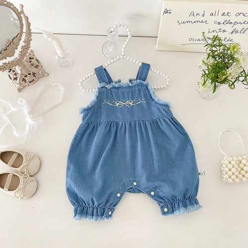 Front view of cotton denim overall romper with bow embroidery for girls