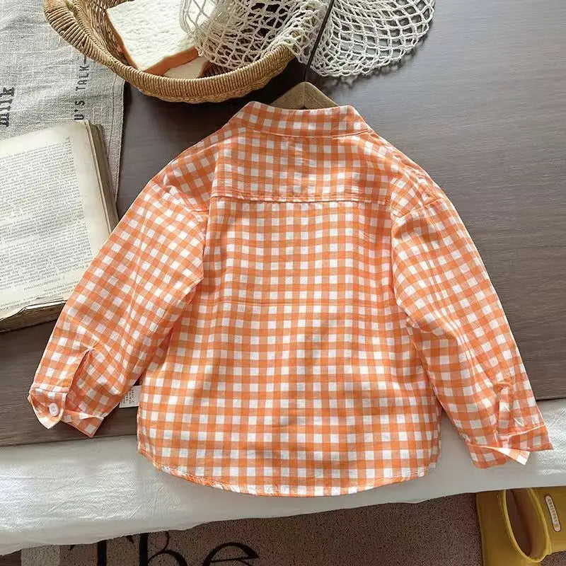 Back view of orange plaid long-sleeve button-up shirt