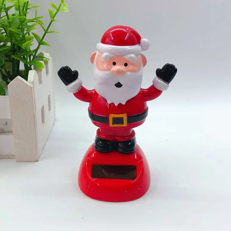 Waving Santa Christmas solar bobblehead with raised arms, a white beard and red base