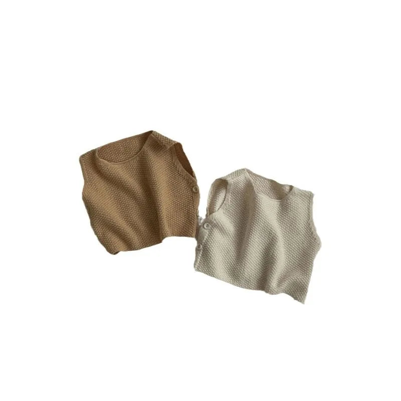 Side view of baby knit vest and shorts outfit in beige apricot