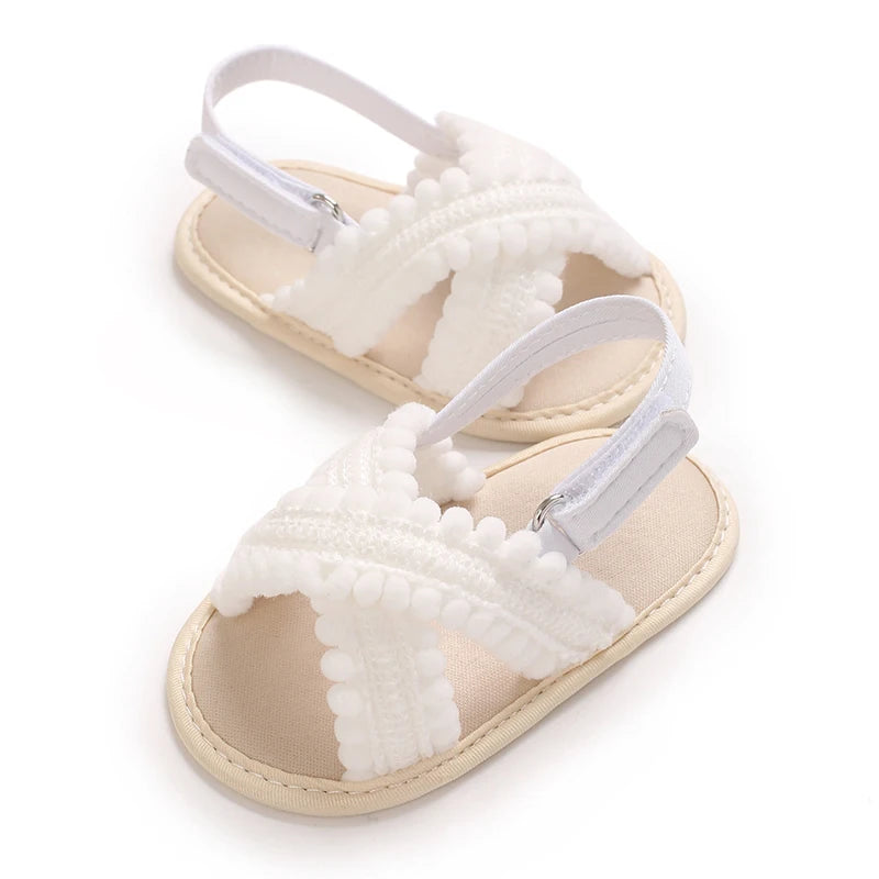 White Scalloped soft sole baby sandals, angled pair view