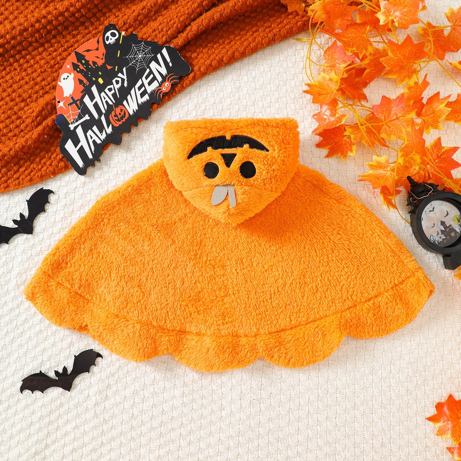 Back view of orange pumpkin fleece cloak costume