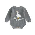 Detail of round neck and long sleeves on knitted baby romper