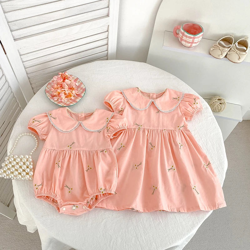 Beige romper with floral embroidery for girls