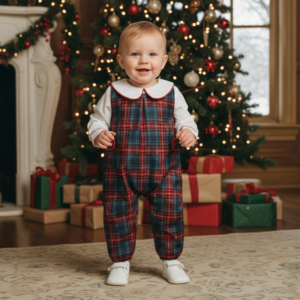 Child wearing red-and-green tartan overalls with a white long-sleeve top and rounded collar edged in red.