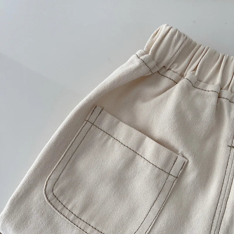 Back patch pocket and elastic waist on beige denim pants