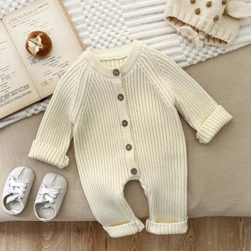 Baby wearing knitted solid color bodysuit